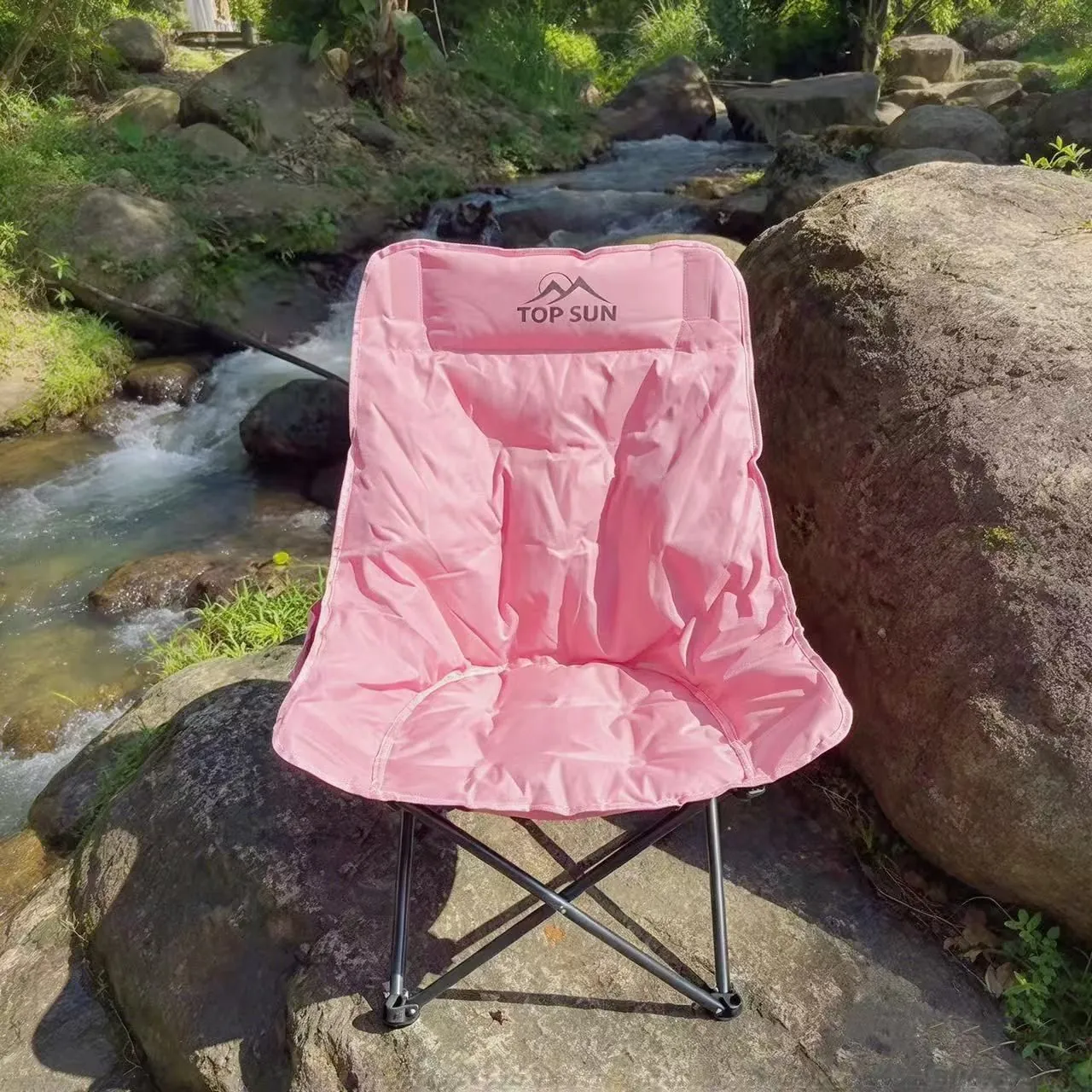 Pink chair above a sea of clouds