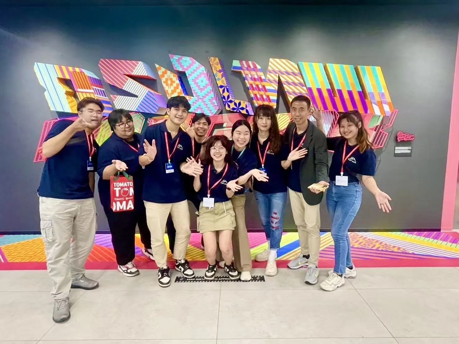 The TOPSUN team in navy polos at a company event
